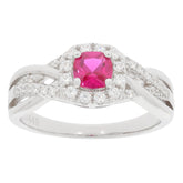 Pink sapphire sterling silver ring with diamond accent, featuring a sparkling gemstone in an elegant design.